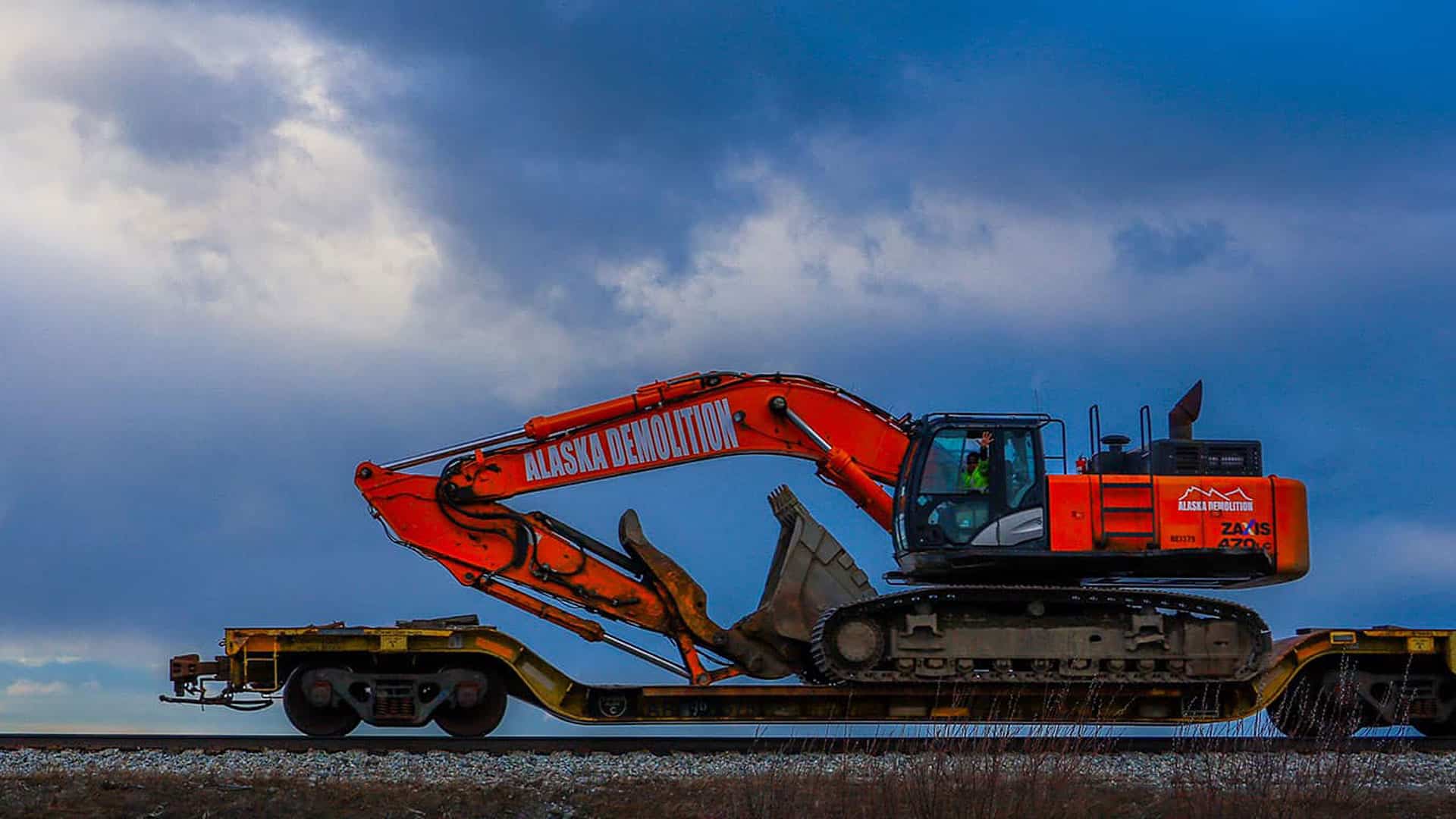 Excavator on train car