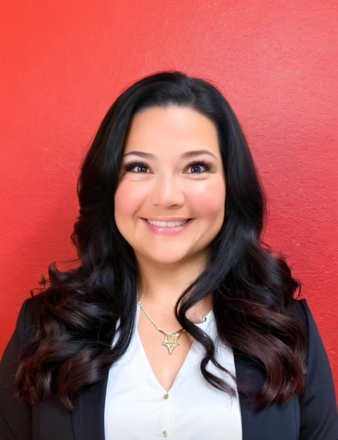 Woman smiling in front of red wall