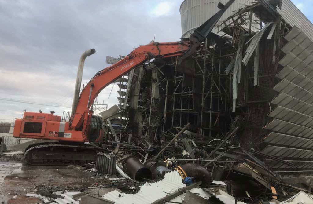 Excavator demolishing