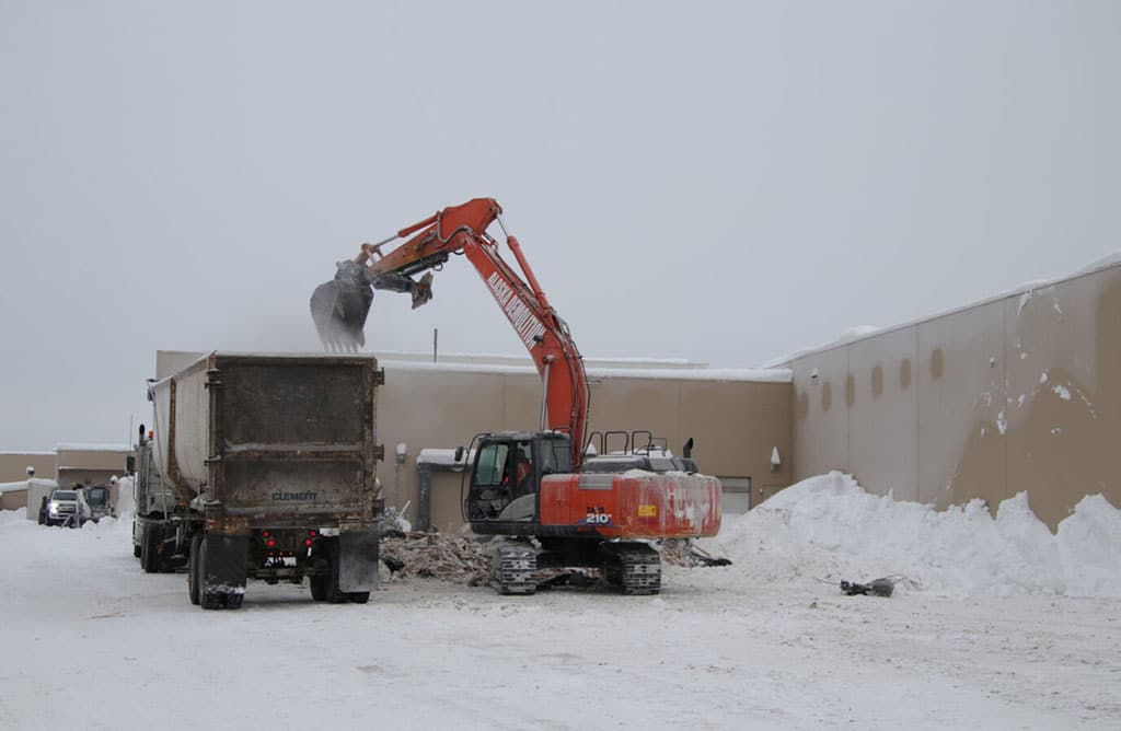 Excavator loading a dump truck